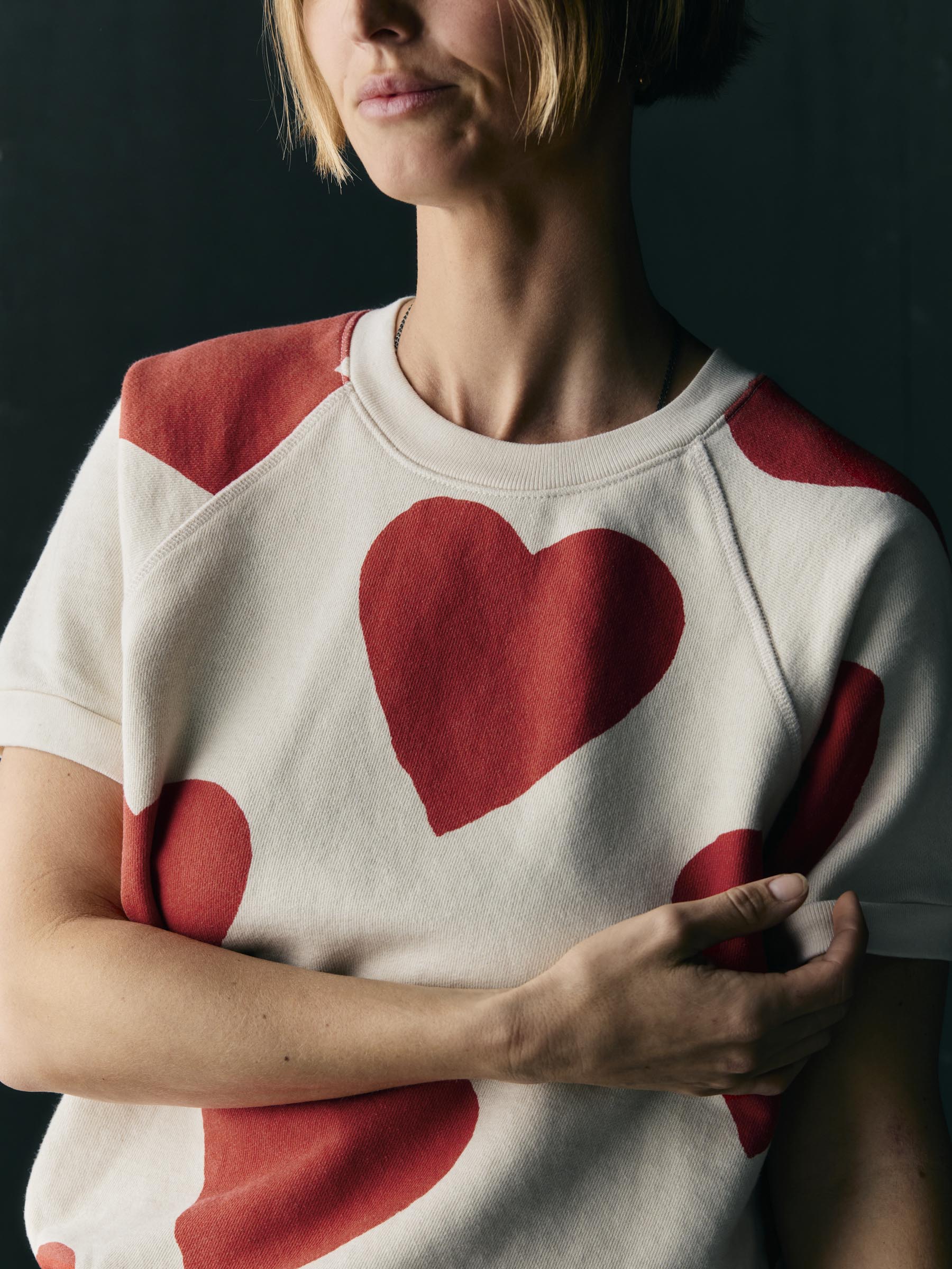 s/s "hearts all over" raglan sweatshirt